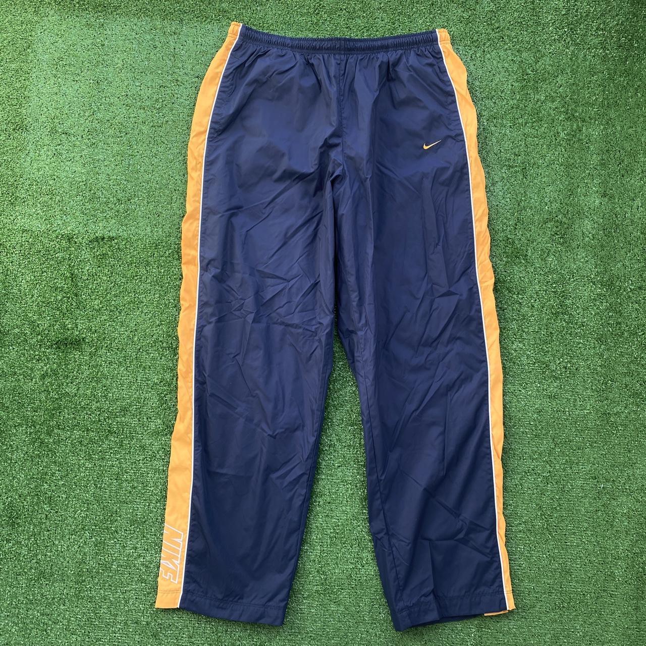 Blue and yellow nike 2024 pants