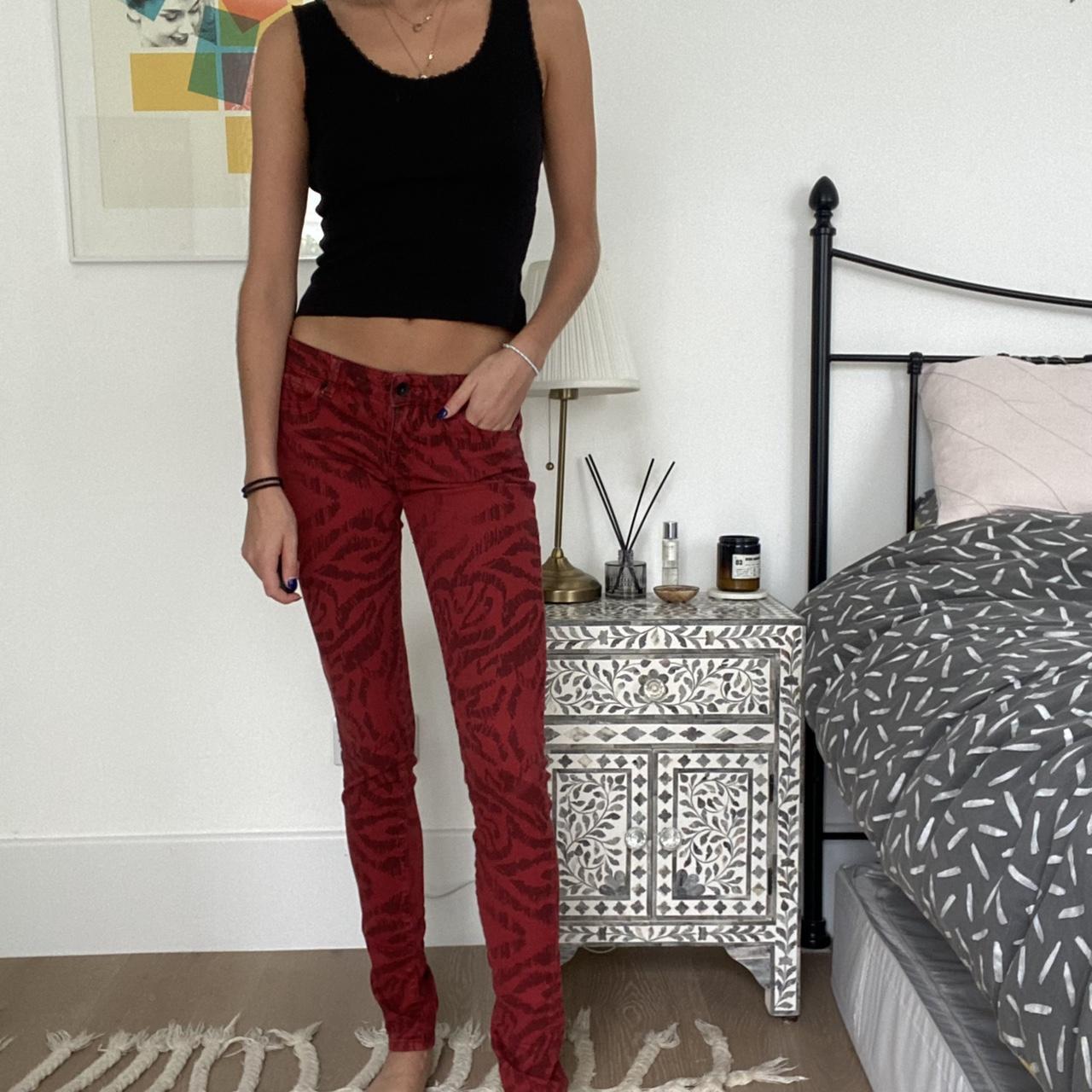 Low rise dark red jeans with black tiger print... - Depop