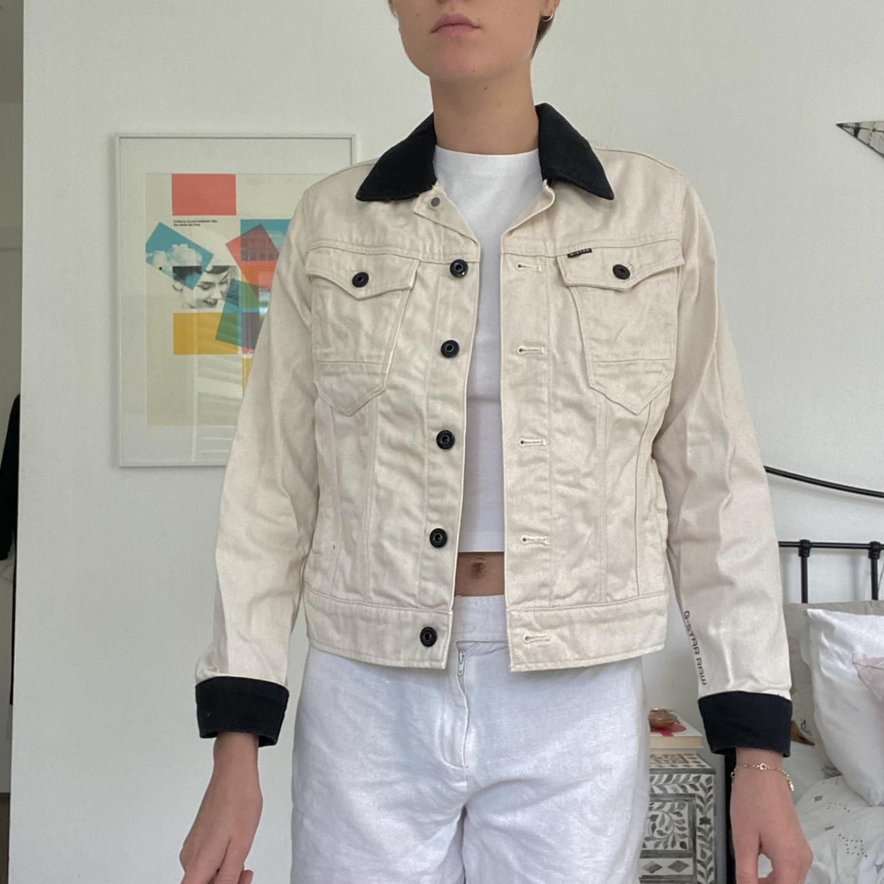 Cream off white denim jacket with black button