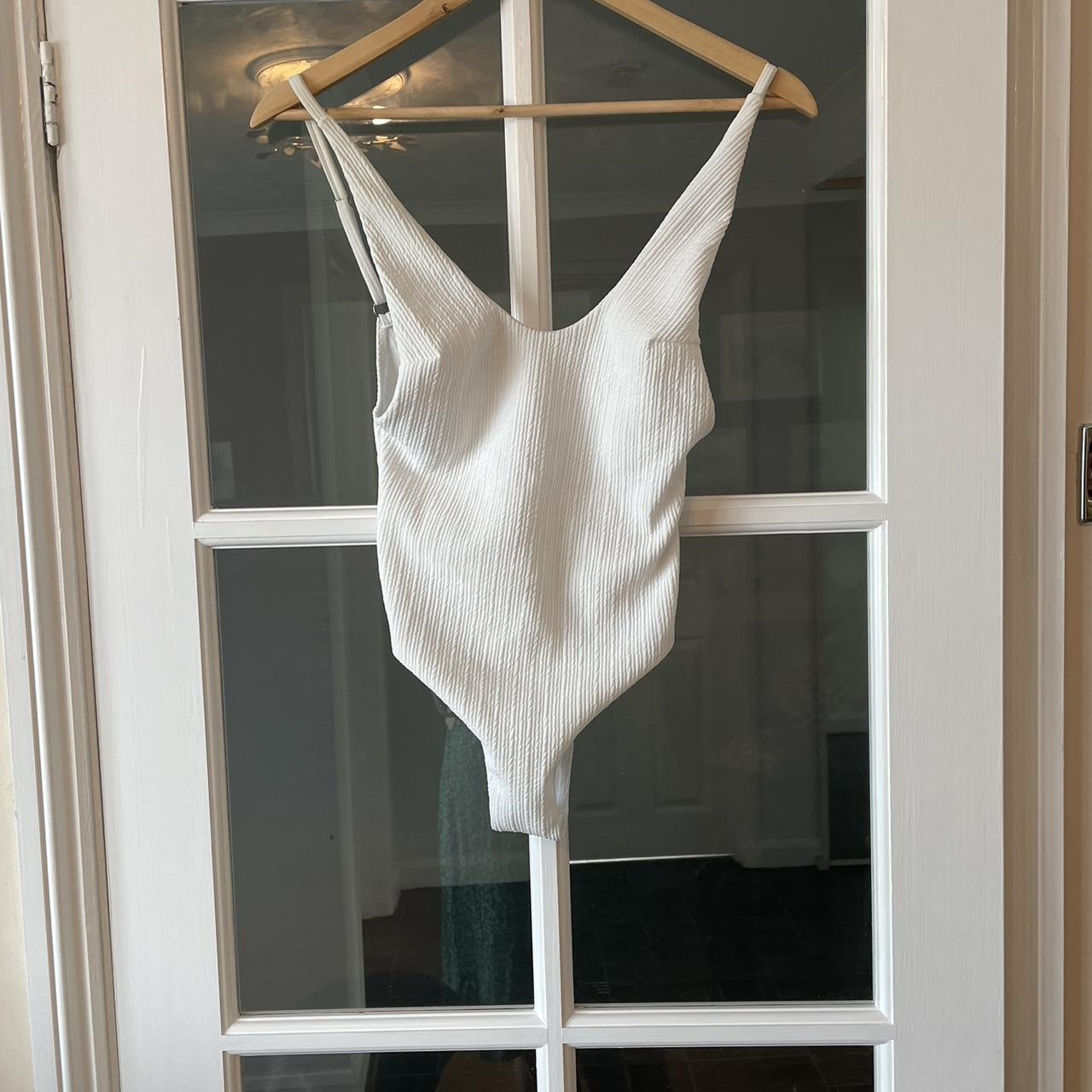 White swimming costume with belt. Very difficult to... Depop