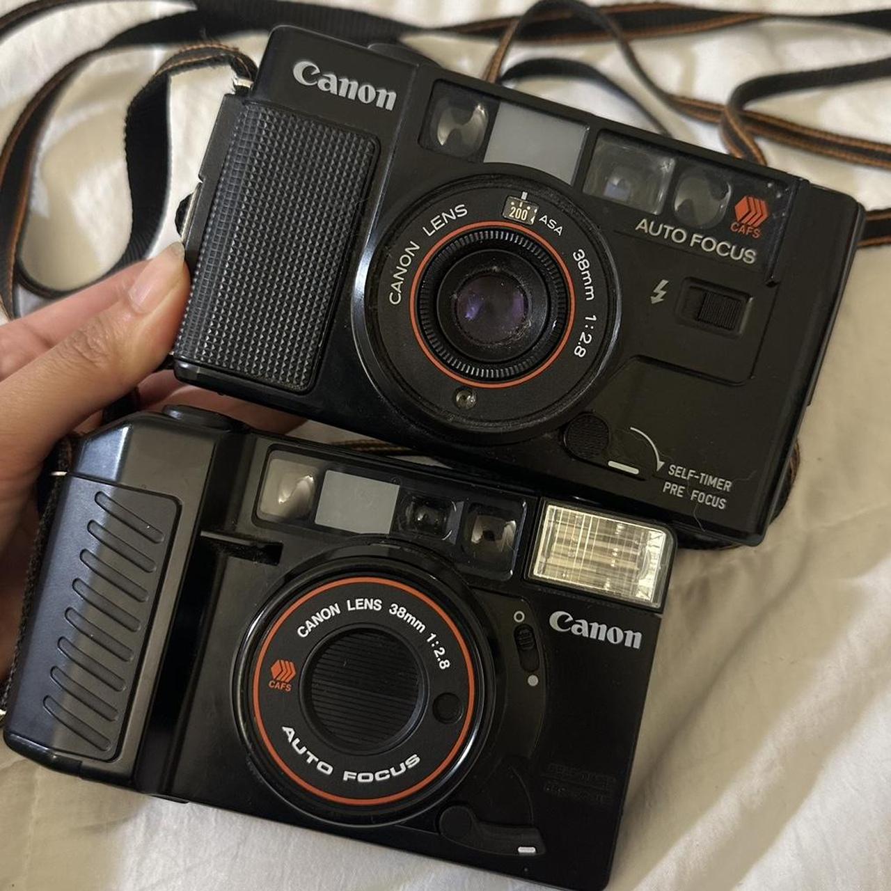 LOT OF TWO CANON FILM CAMERAS for parts auto focus... Depop