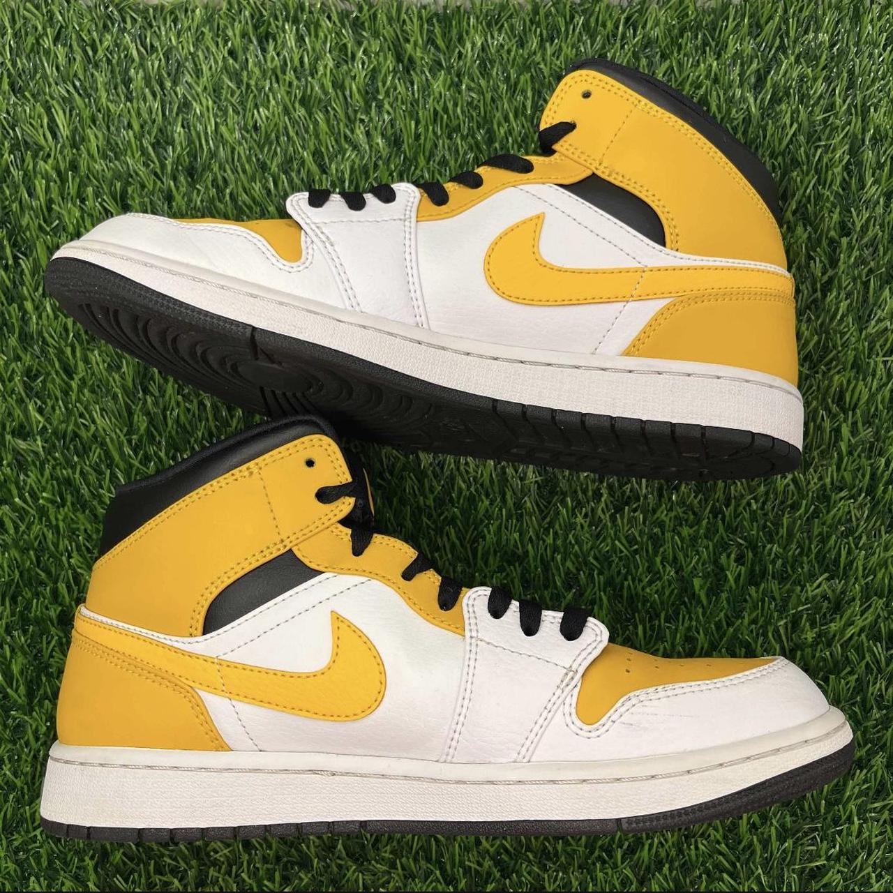 air jordan 1 mid university gold on feet