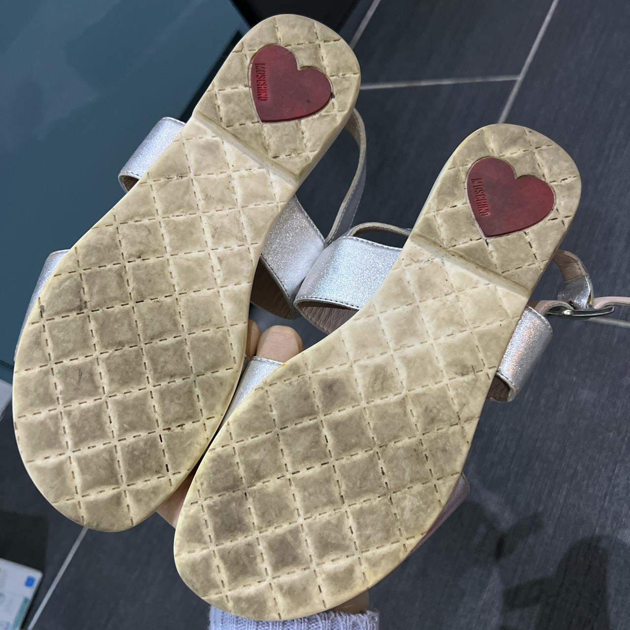 black and blue nike slides