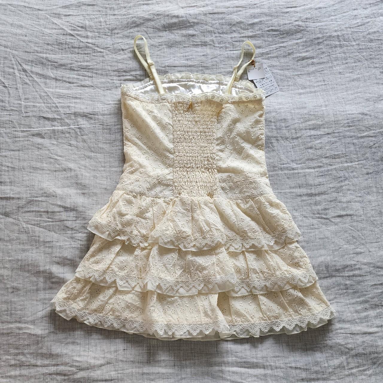 cream lace corset lace up tiered dress! imported... Depop