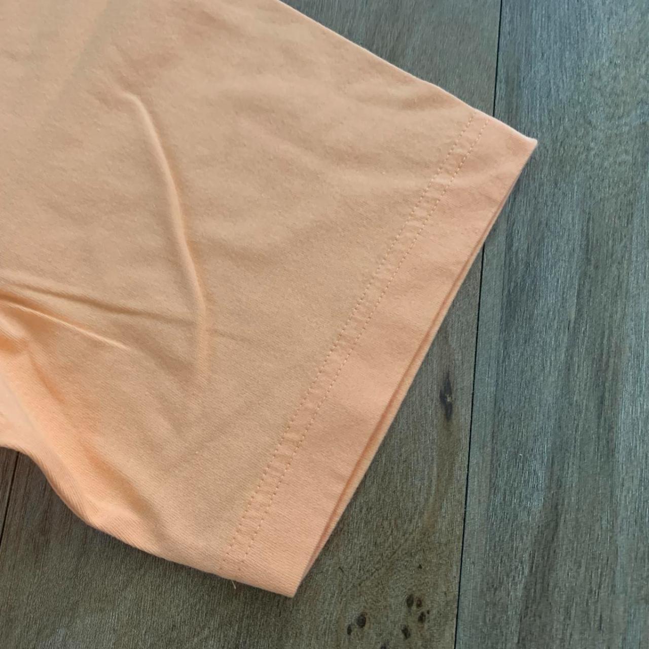 large uniqlo peach/orange tshirt, can fit an - Depop