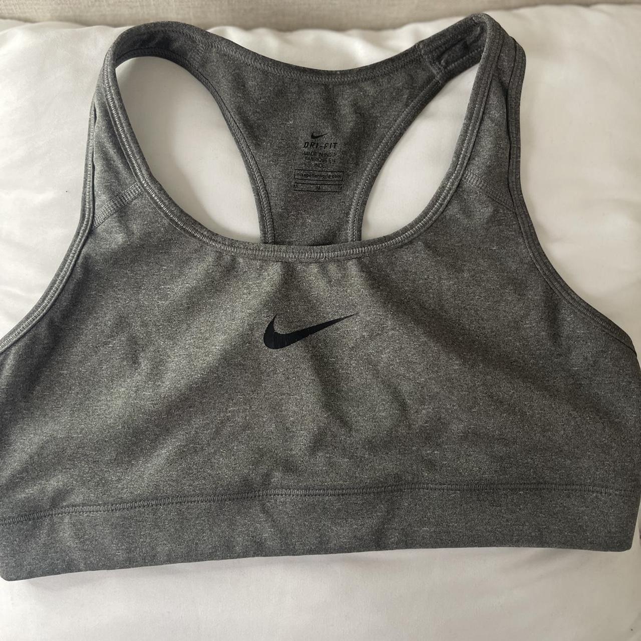 Grey Nike sports bra size medium lightly worn - Depop