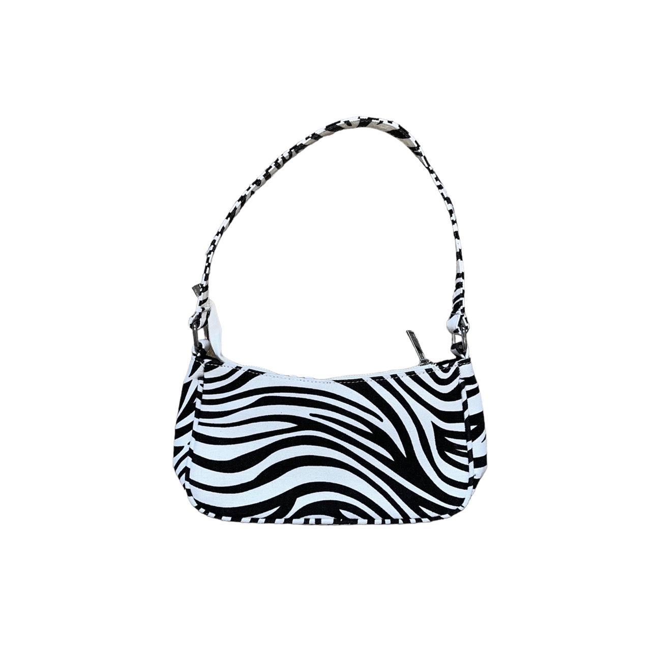 Zebra print baguette bag not 100 sure but I think Depop