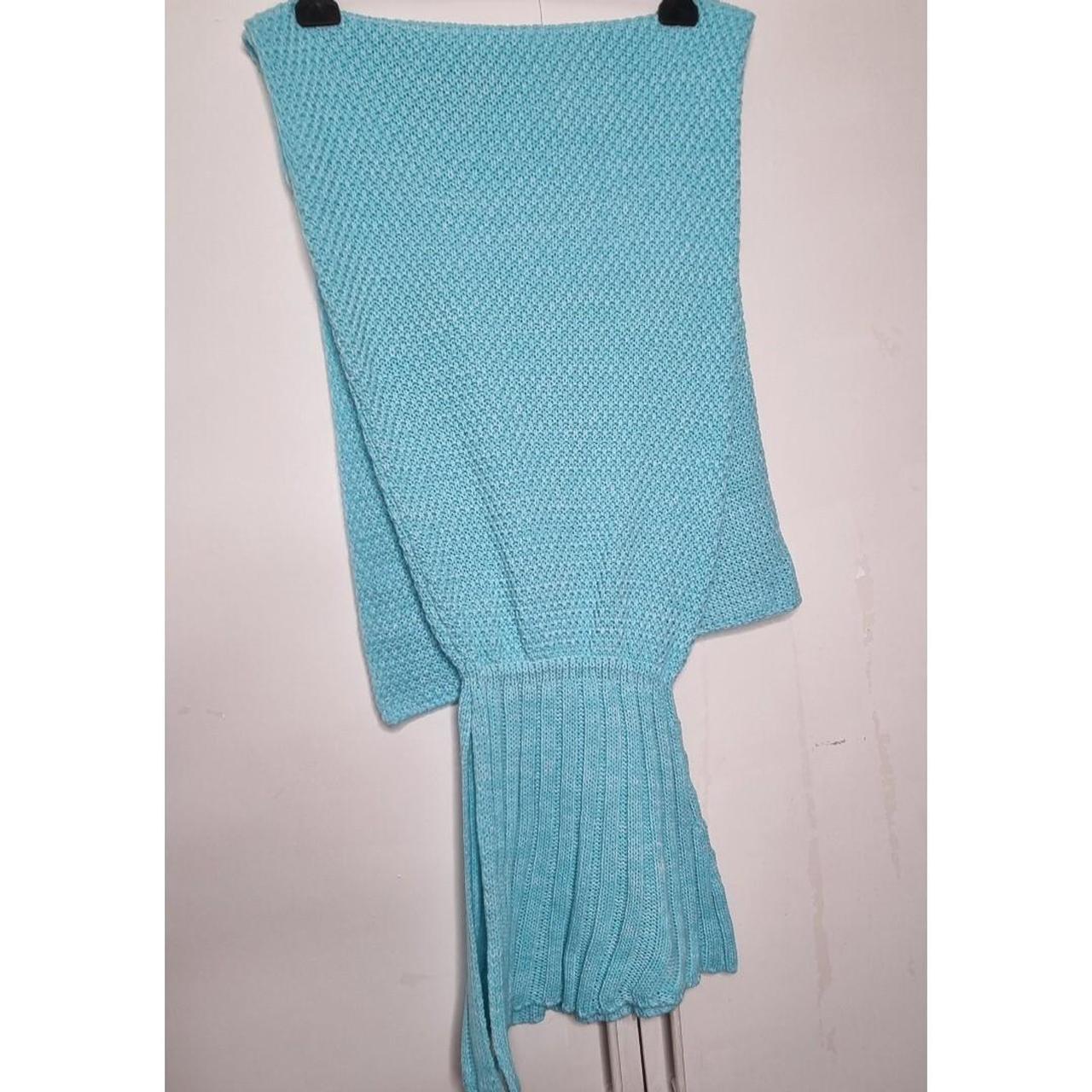 Blue knitted mermaid tail blanket from primark. Depop