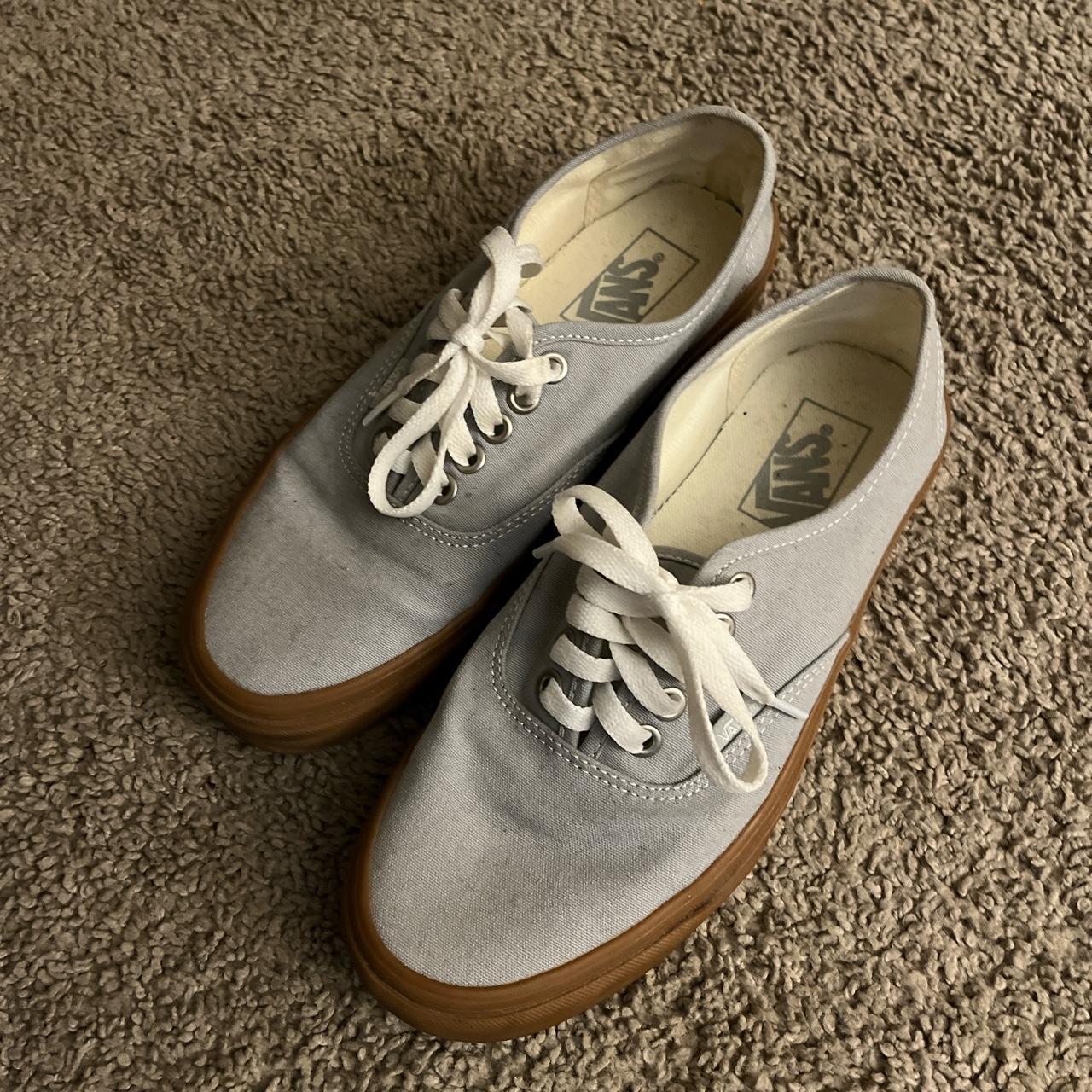 Gray vans shop with blue laces