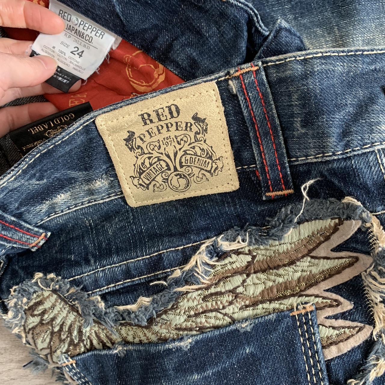 Red Pepper jeans with spell out print and wing... - Depop