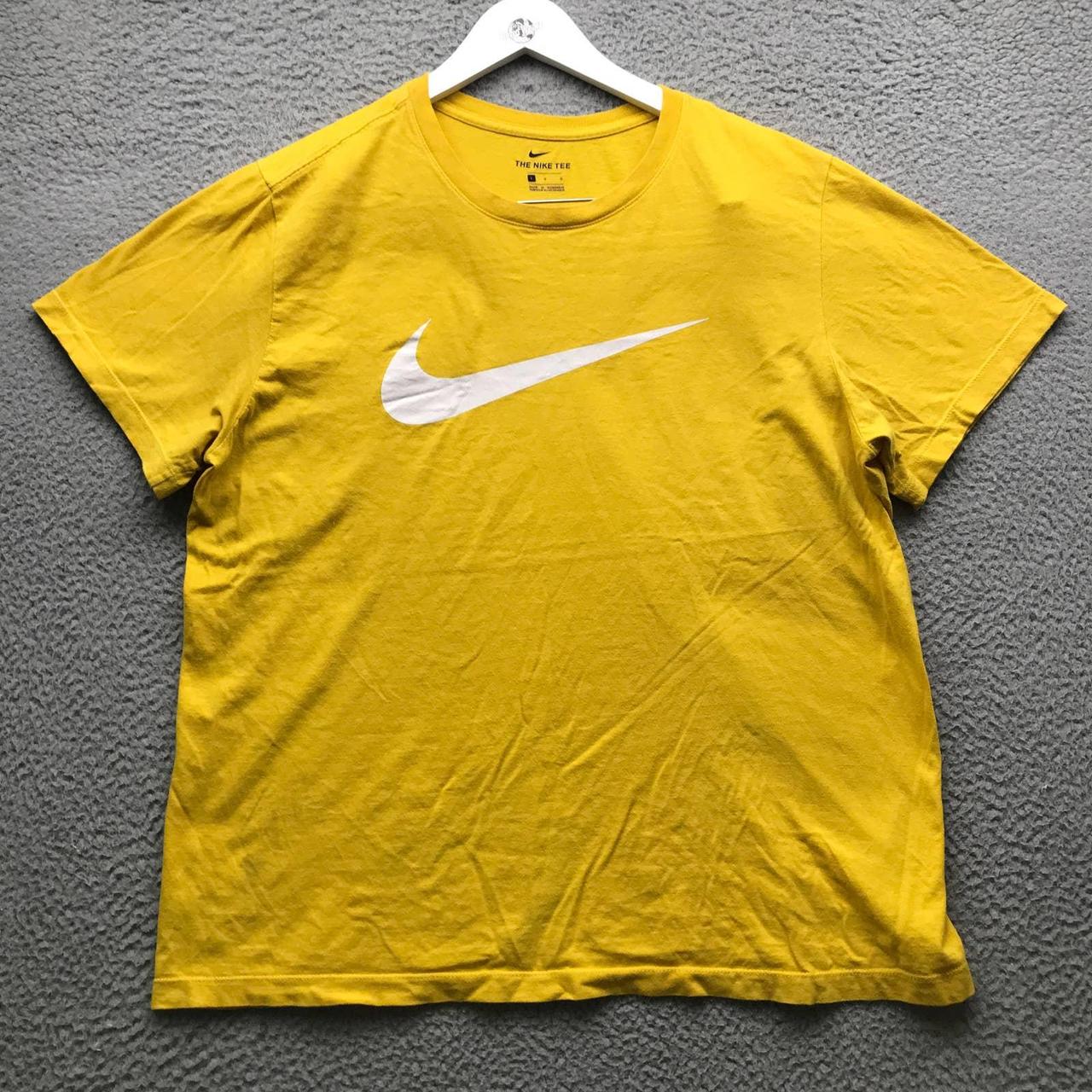 yellow and white nike shirt