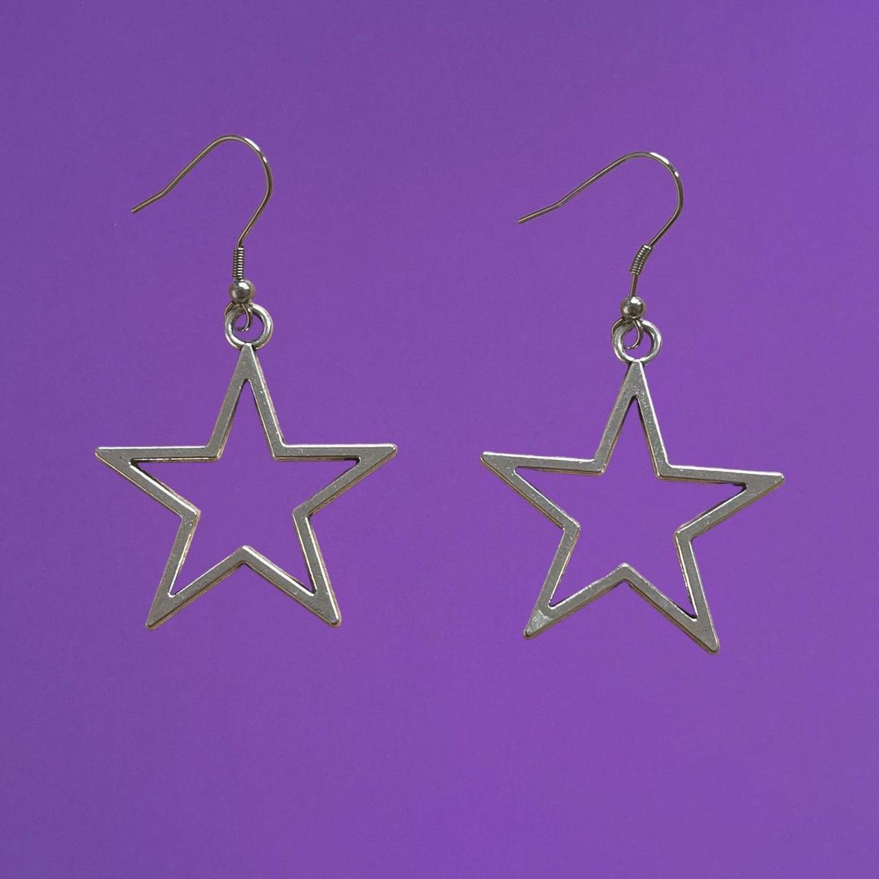 silver star earrings star hand for scale zinc... - Depop