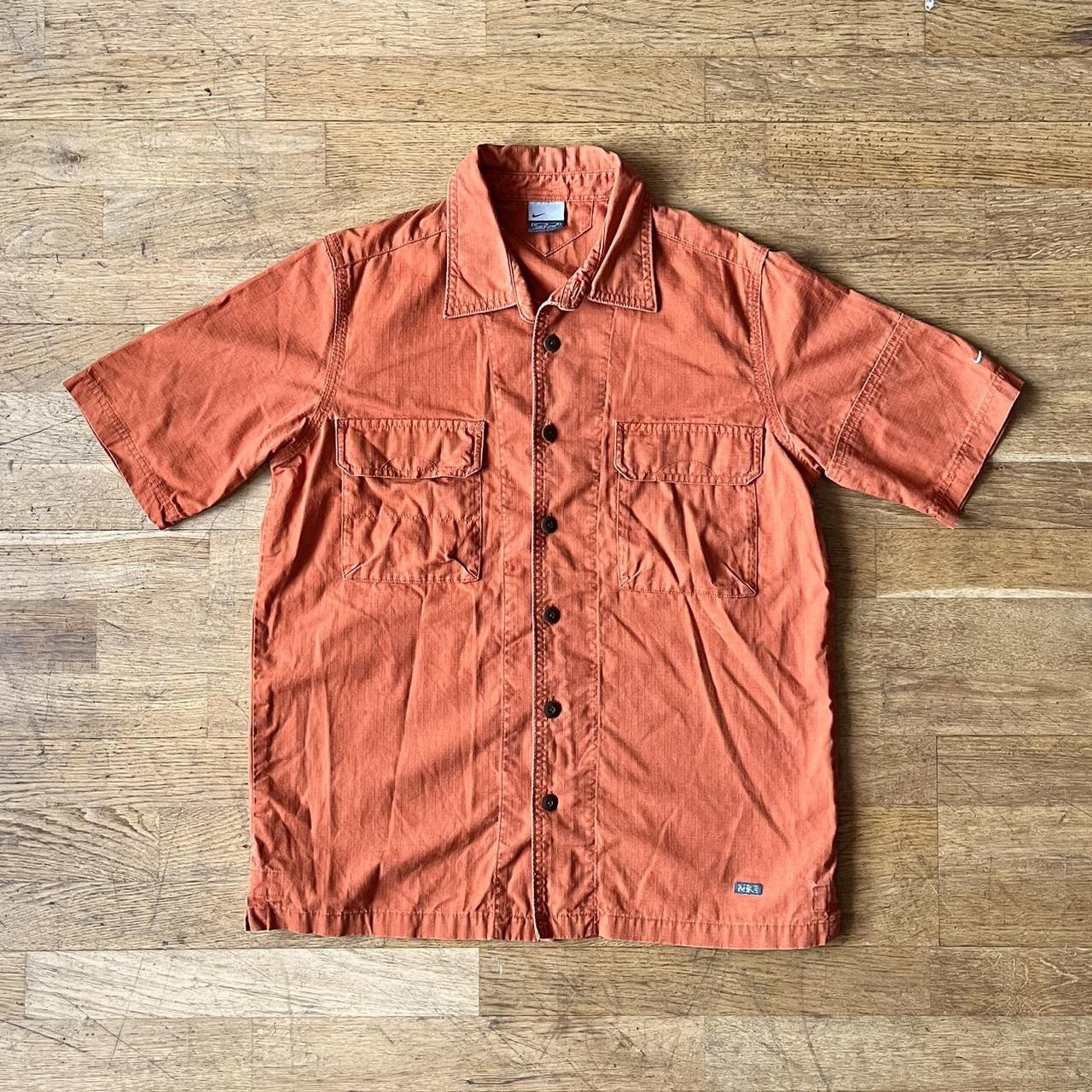 fluorescent orange nike shirt