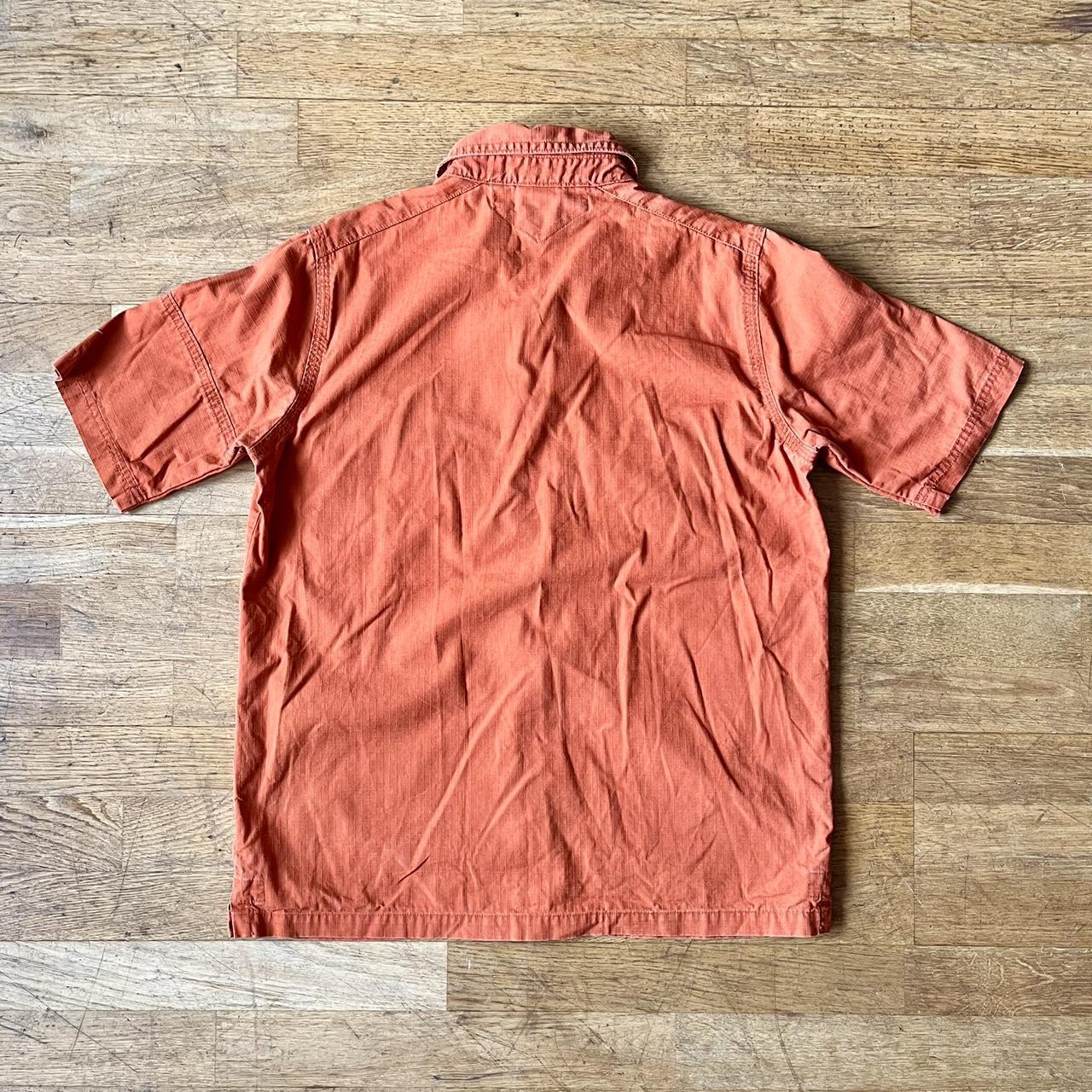 fluorescent orange nike shirt