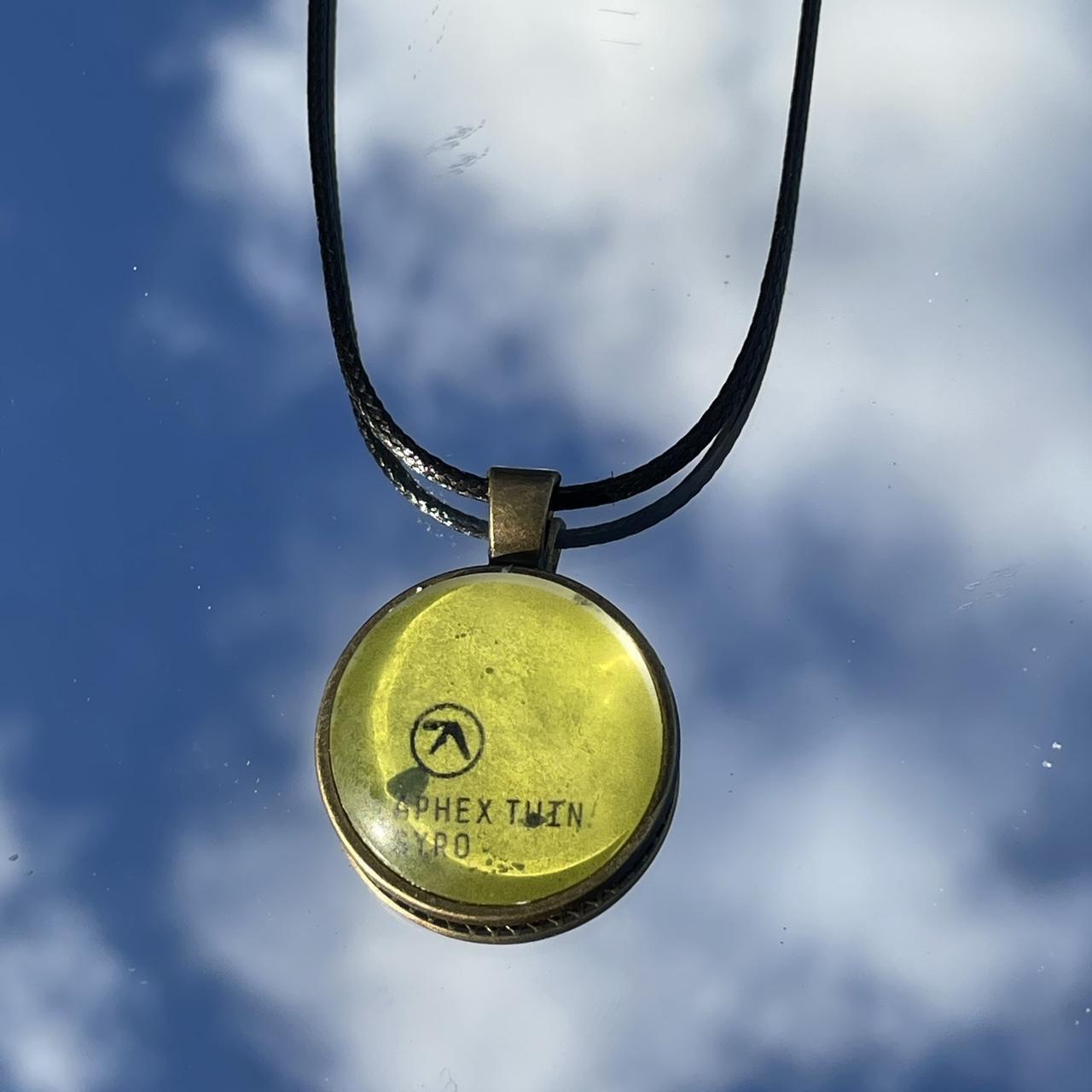 aphex twin gold pendant💚 album syro... Depop