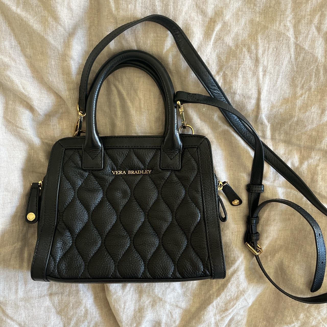 black Vera Bradley quilted leather bag strap is