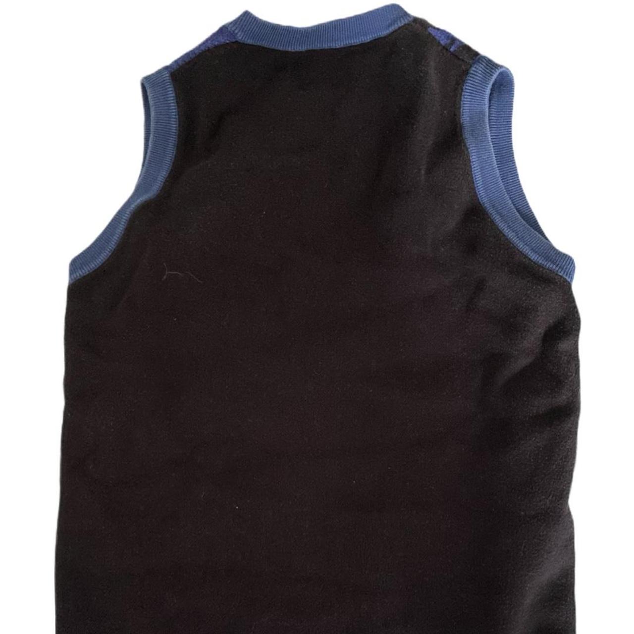 This ICONIC kissing blue vest from Heavn by Marc...