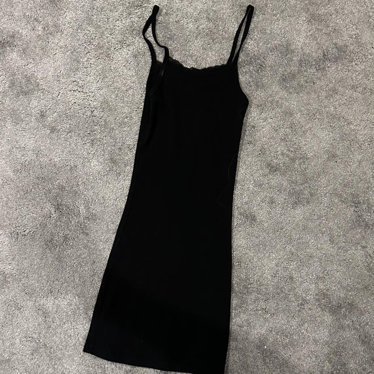 Brandy Melville dress in black with lace trimming... Depop