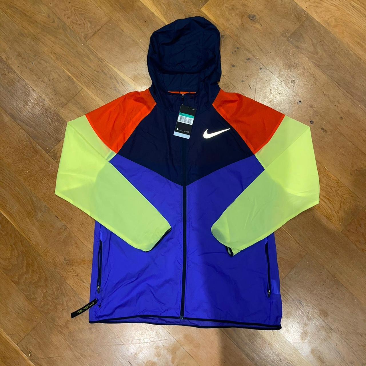 Nike Lightweight Reflective Tick Windbreaker... - Depop