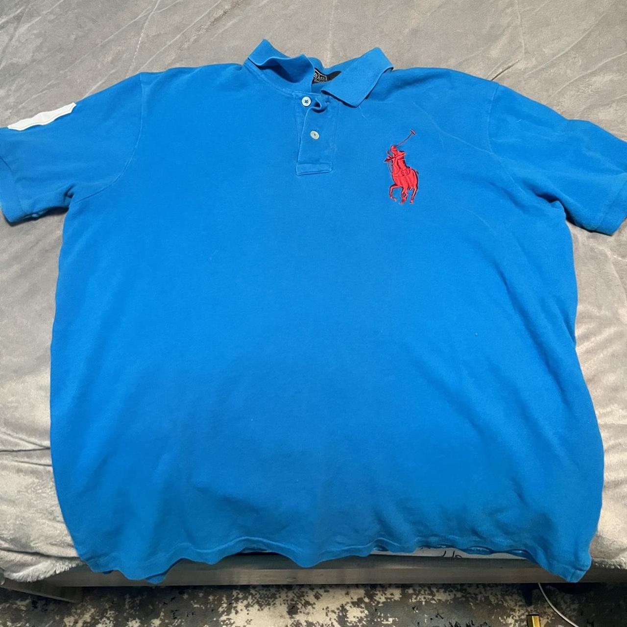 Blue polo shirt store with orange horse