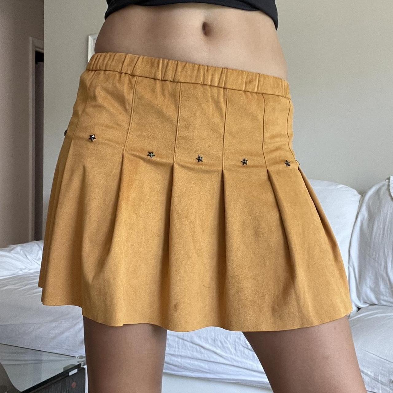 faux suede brown pleated mini skirt with star studs. Depop