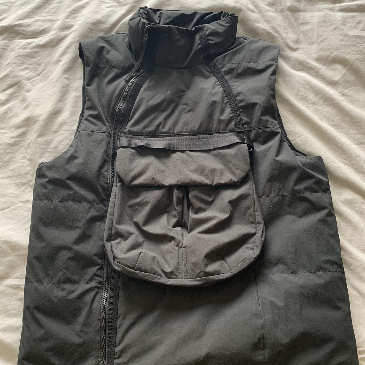 Nike tech pack vest hotsell down filled