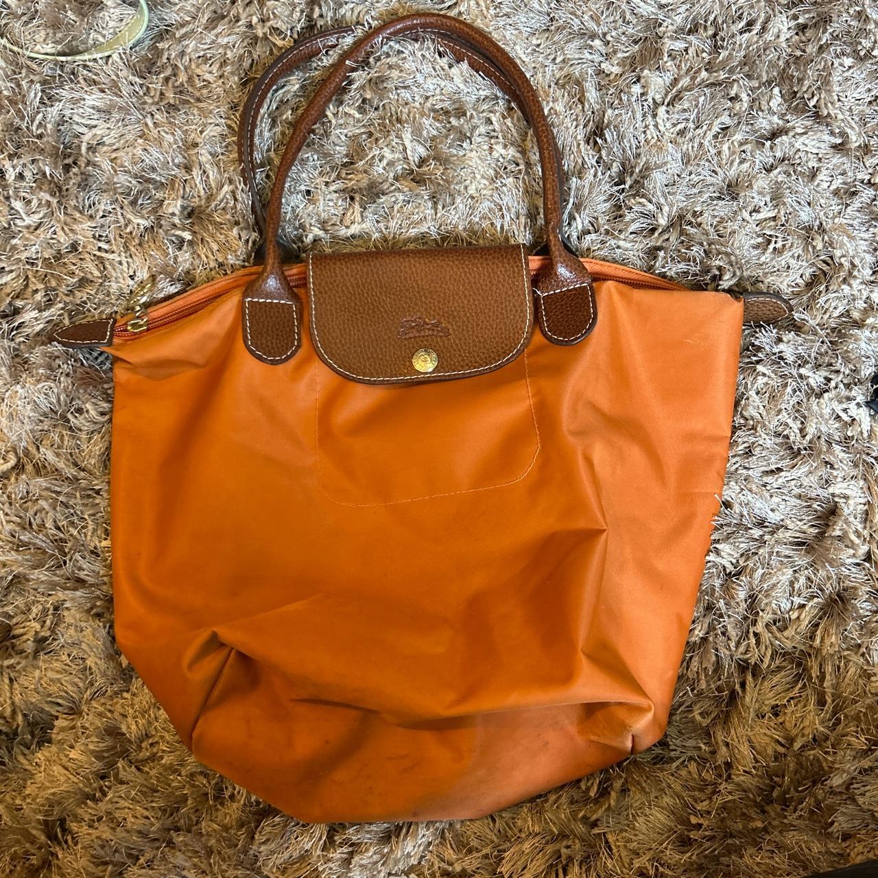 Authentic Longchamp bag. In orange- this is being... - Depop