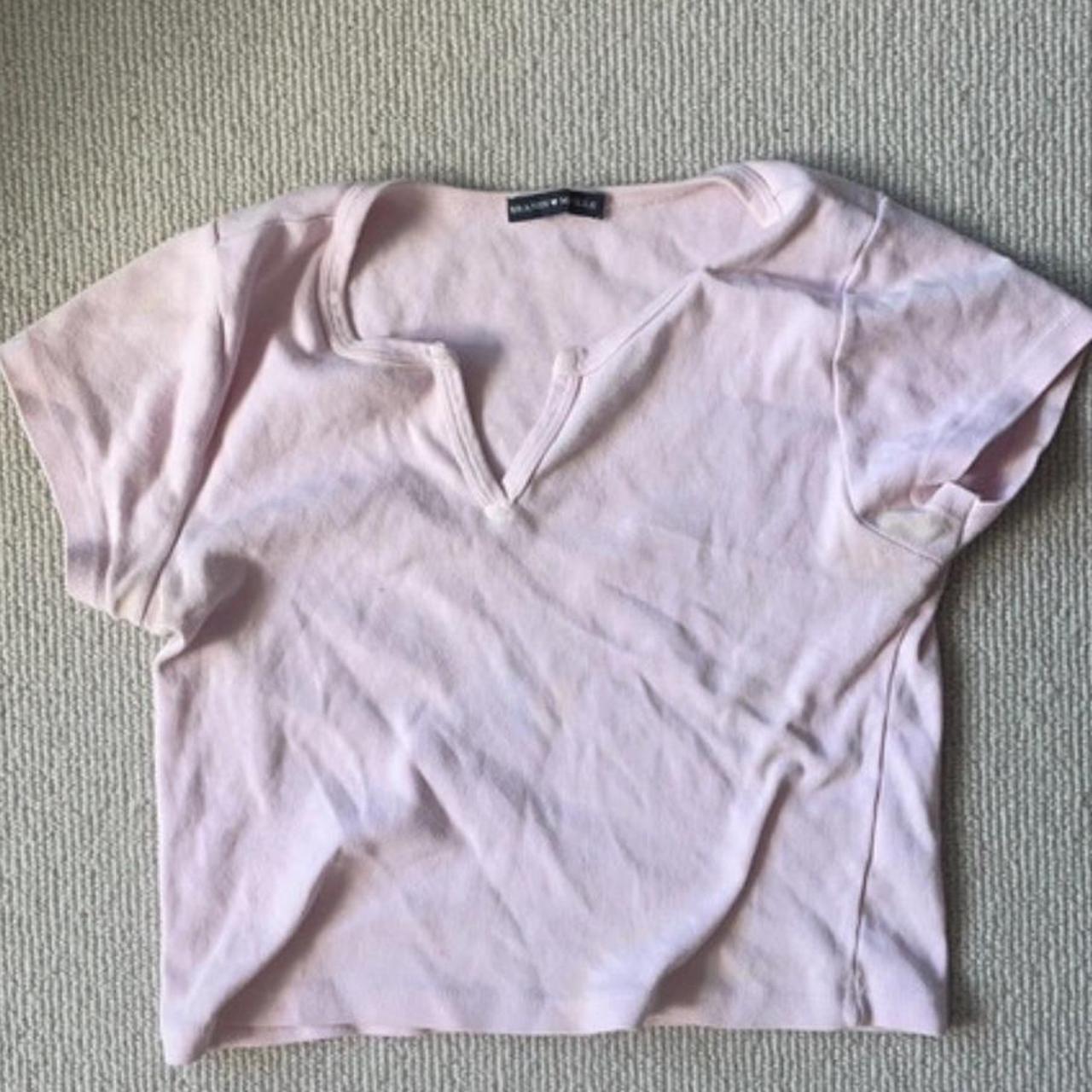 brandy melville pink baby tee does have a stain on... Depop