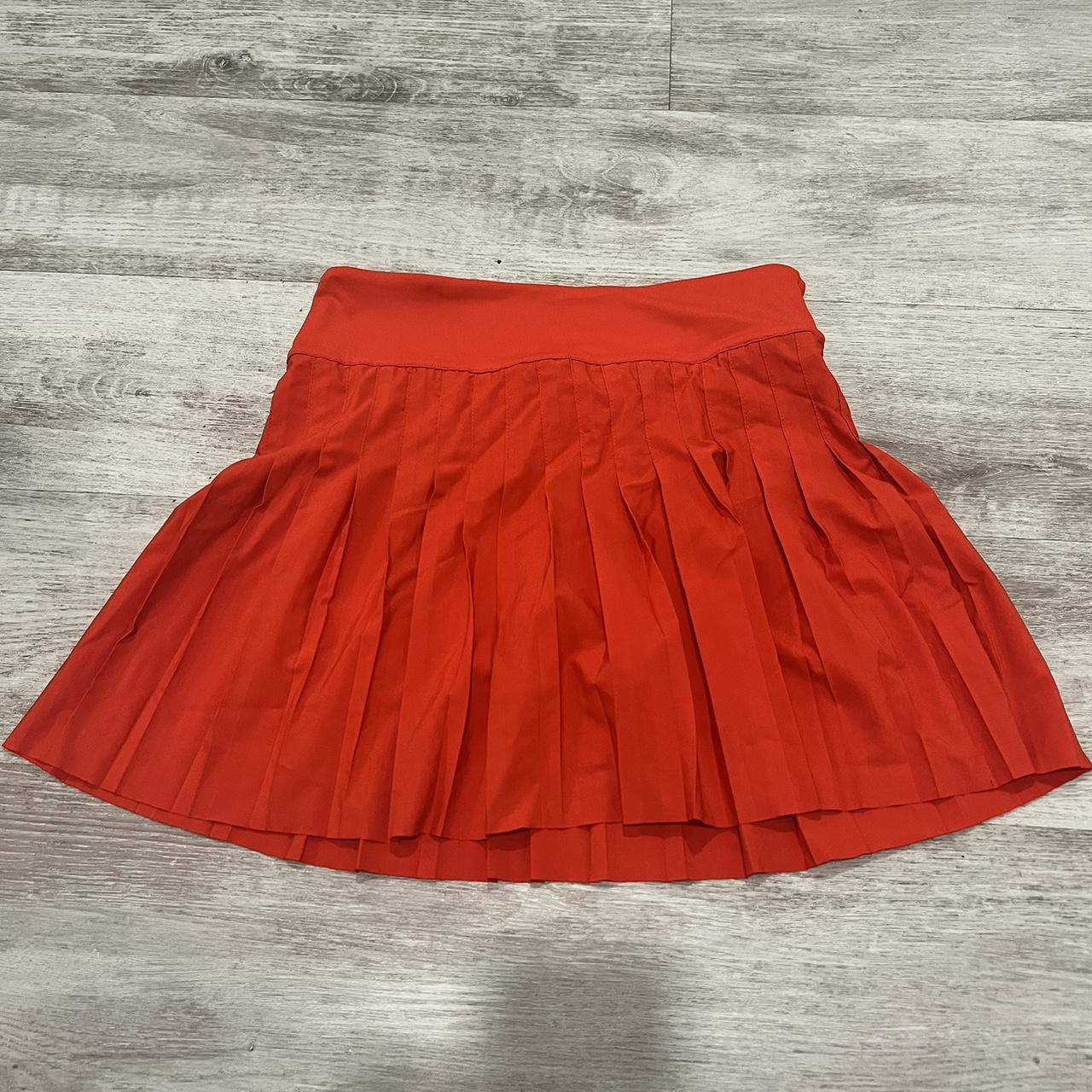 Red tennis skirt size medium. No label but the fit... - Depop