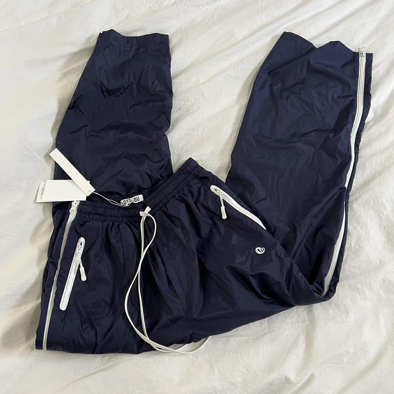navy baggy nylon tracksuit bottoms with zips and... Depop