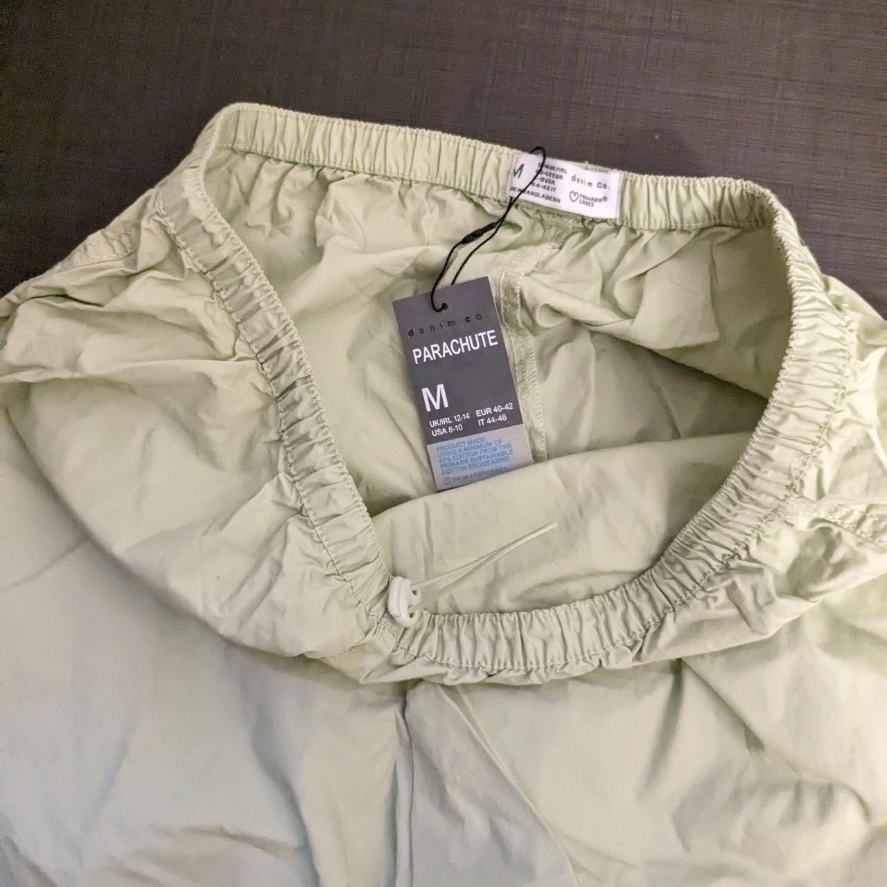 Primark parachute green khaki trousers pants. Size... - Depop