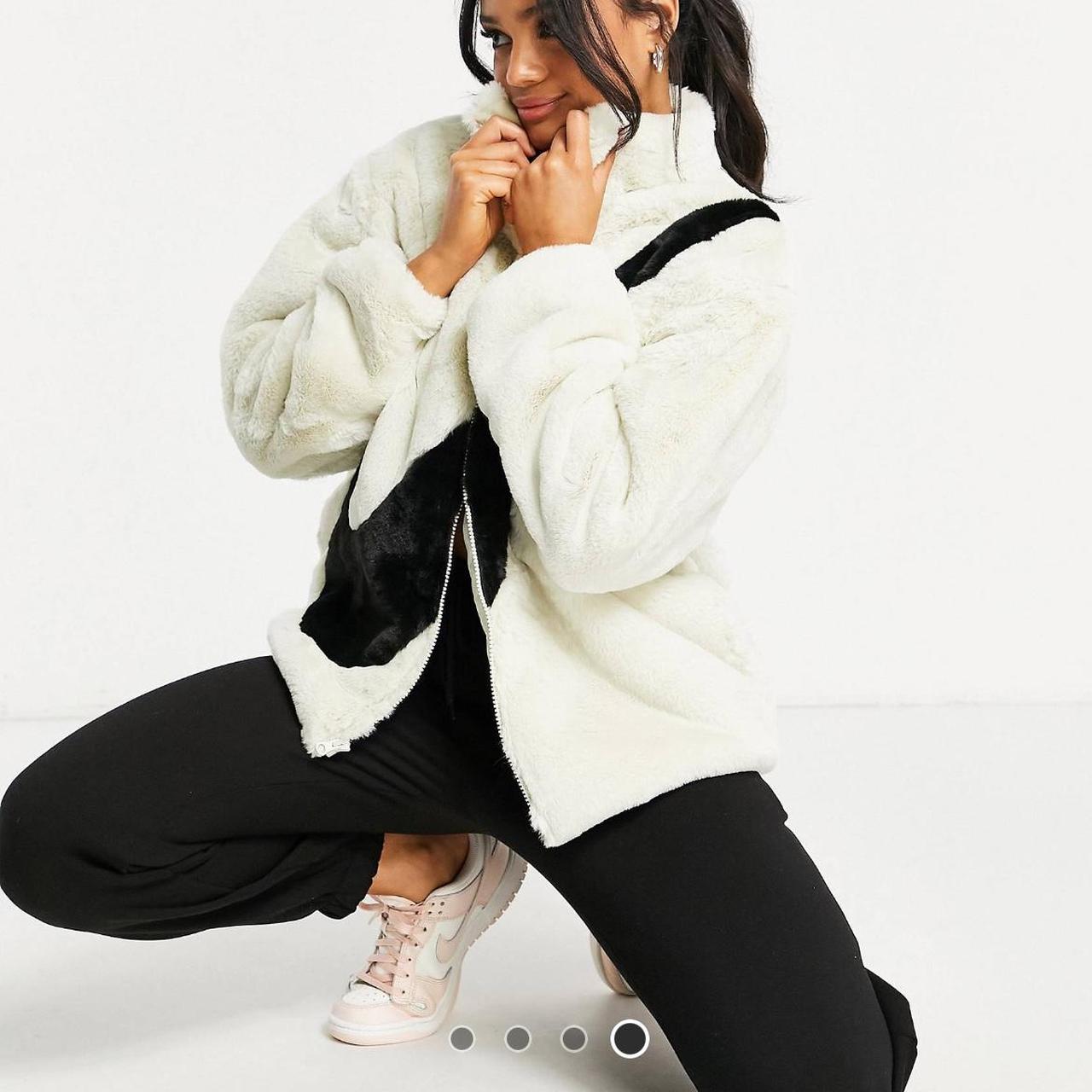 nike faux fur oversized swoosh jacket in purple