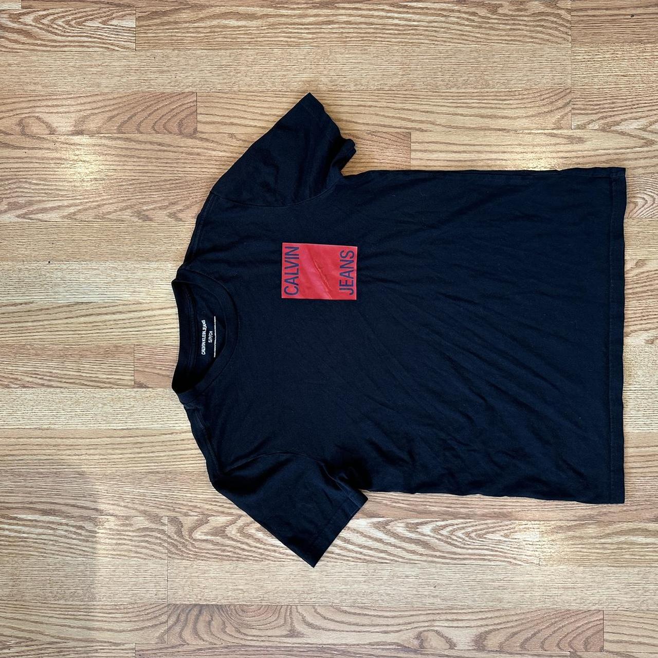 Black and red Calvin Klein jeans graphic