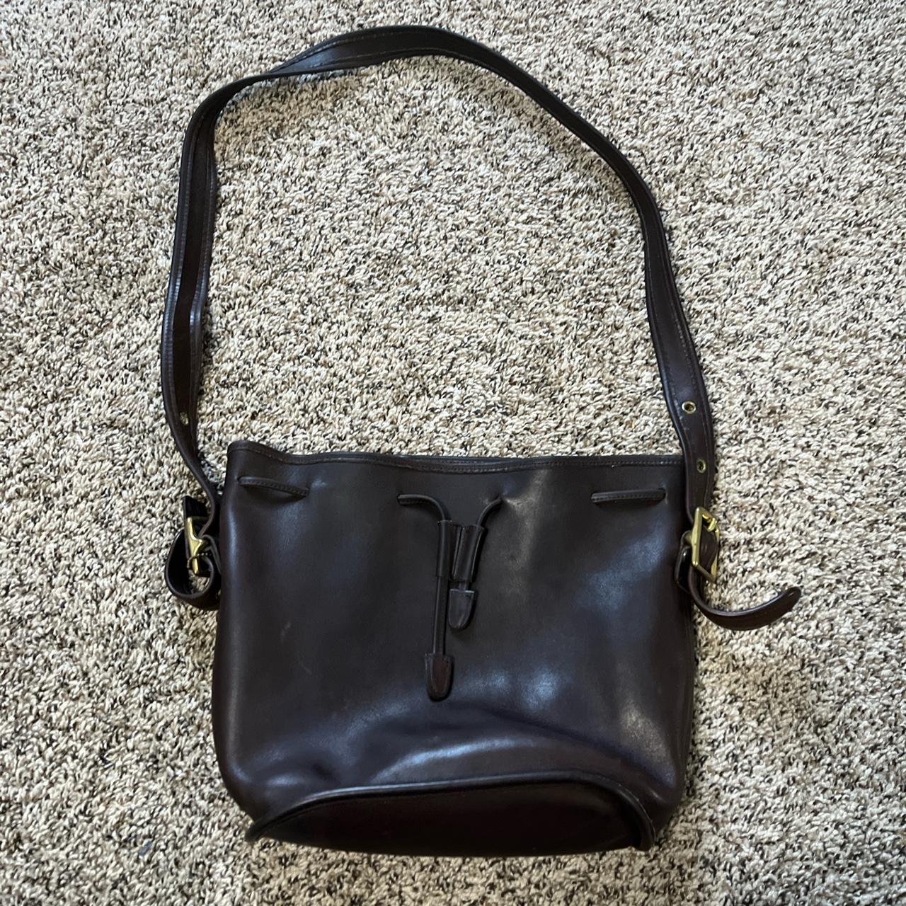 Brown shoulder bag. This bags does have flaws on the... - Depop