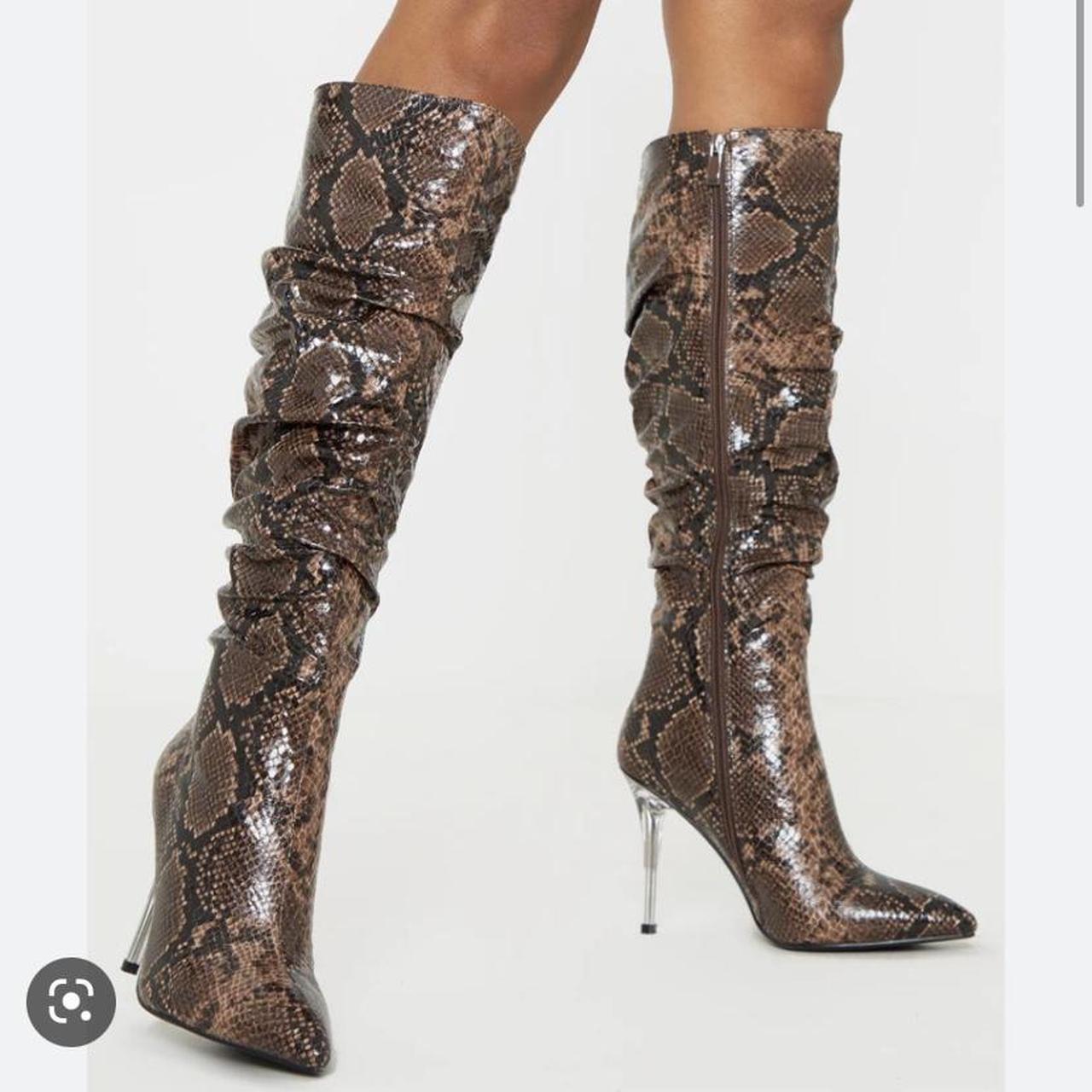 snakeskin print knee high boots