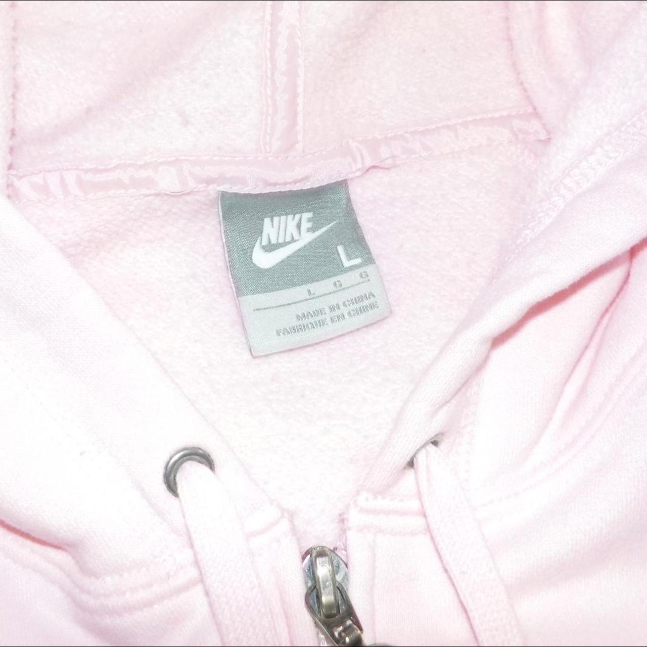 Baby pink nike jacket size L but fits a size S - Depop
