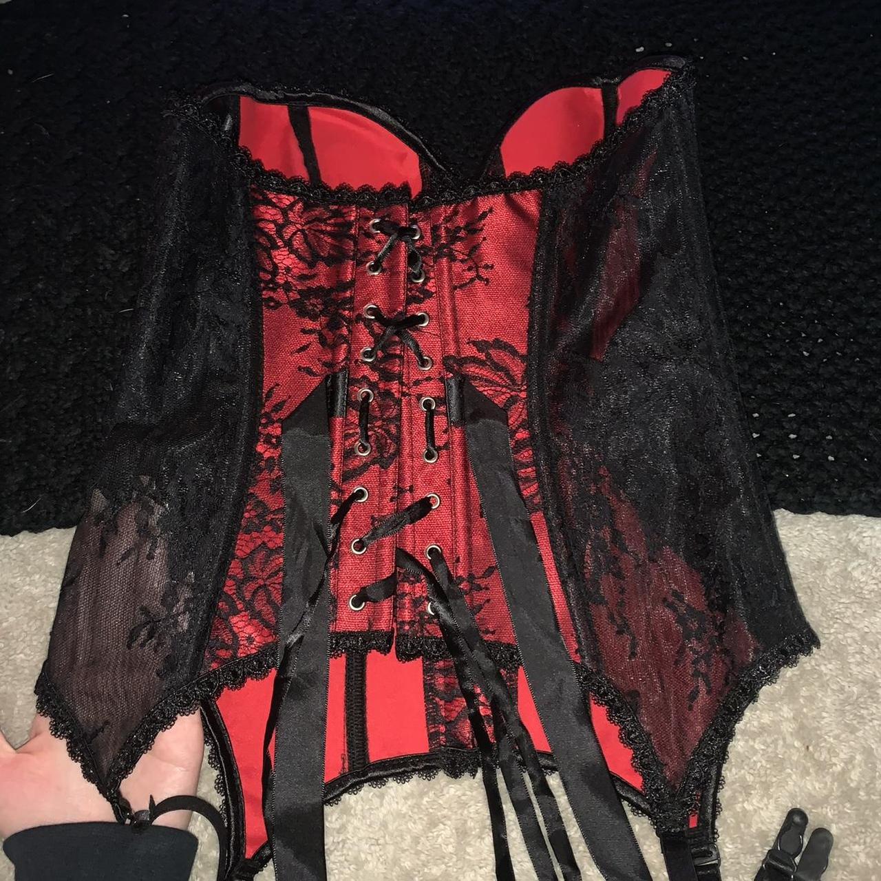 red corset top by the brand vaacodor. features black - Depop
