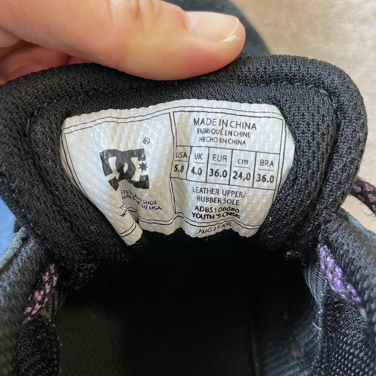 black and purple dc shoes