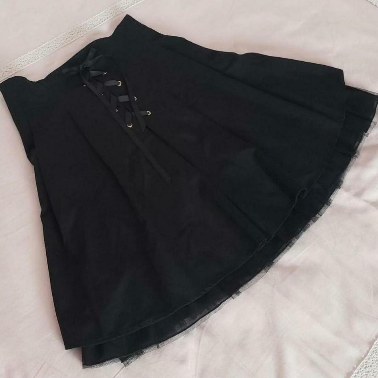 Elegant black pleated skirt adorned with a bow and... - Depop