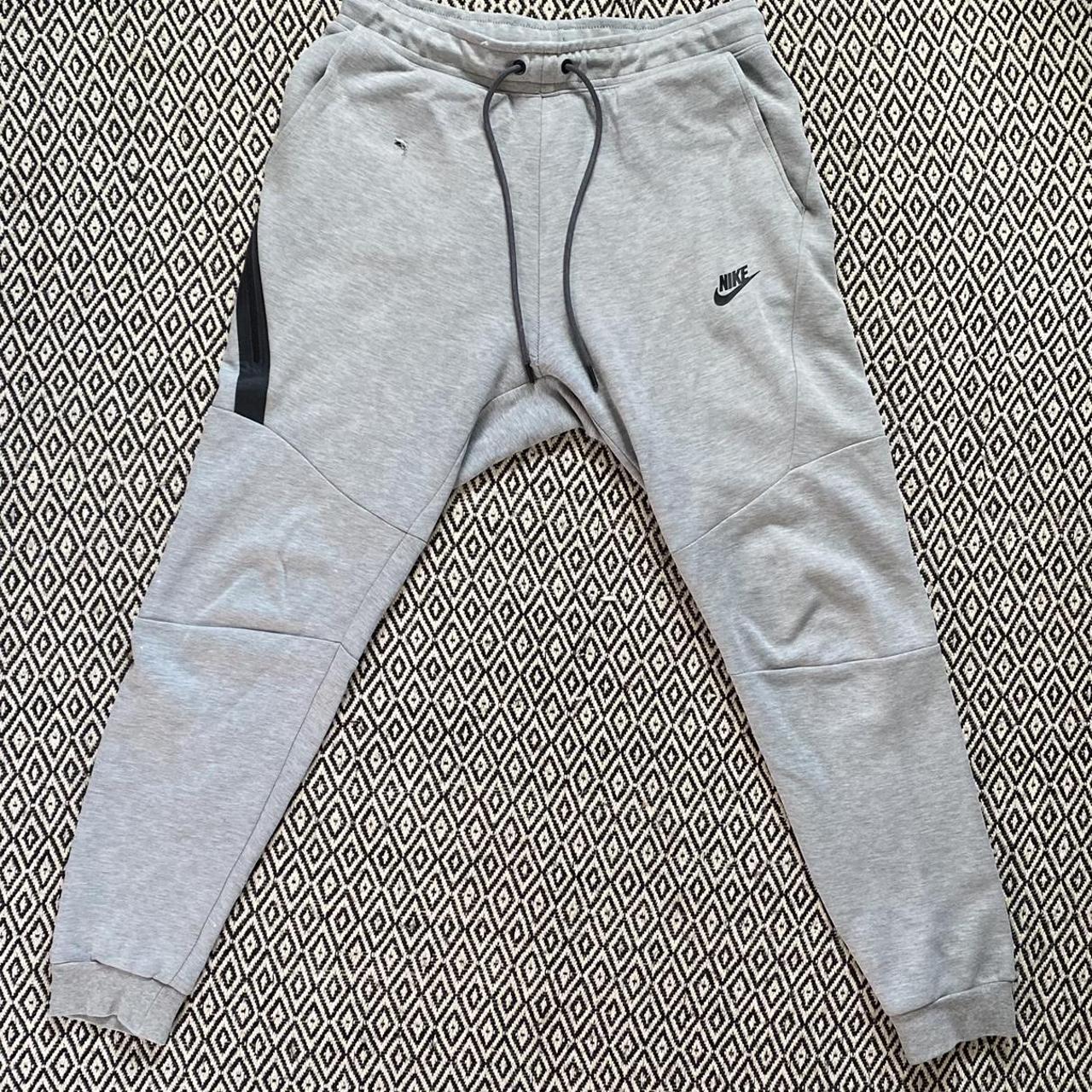 Grey Nike tech fleece joggers. Size Small but would... - Depop