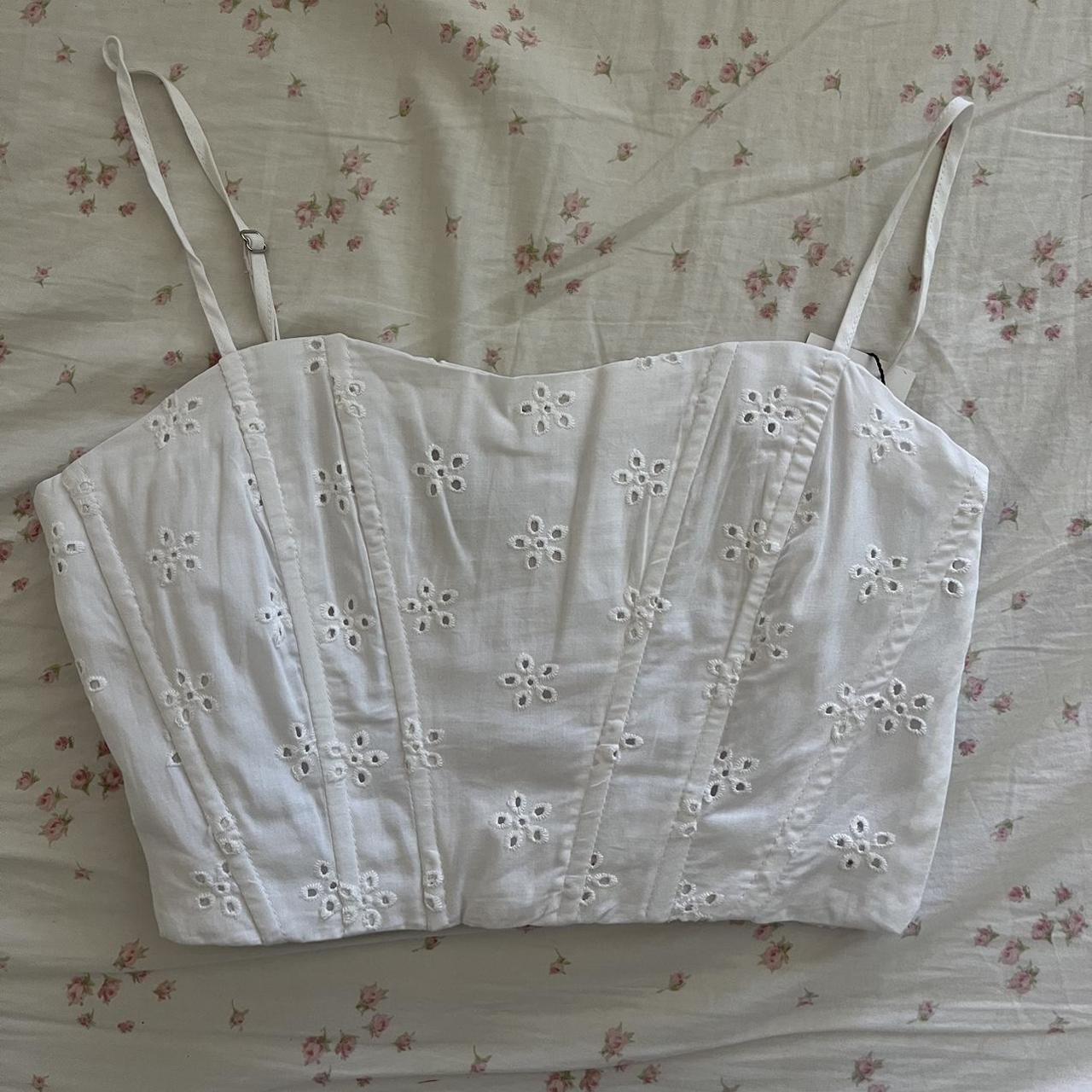 white corset crop top with pretty flower detailing,... Depop