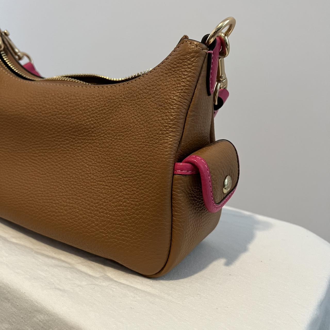 Coach shoulder bag. Brown with pink accents. Strap