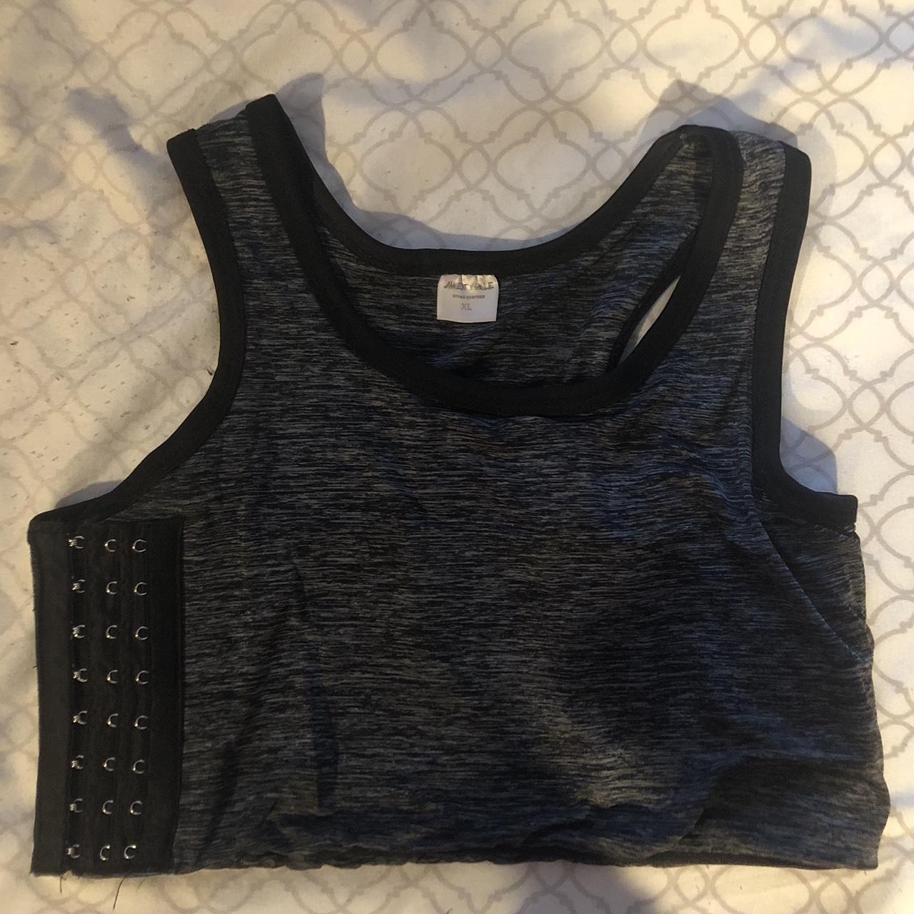 Chest binder clasps on the side, fits L/XL and up... Depop