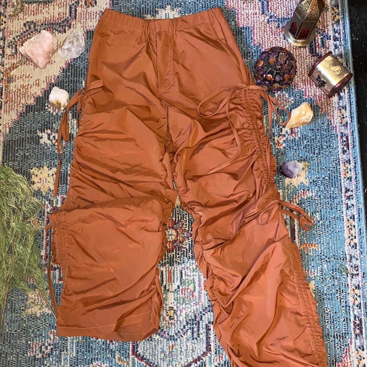 Orange combat style pants with slit knees and tie up... - Depop