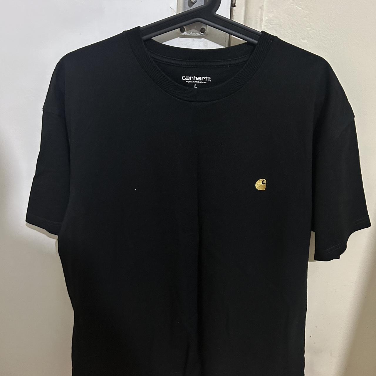 Black Carhatt T-shirt in a size large but also fits... - Depop