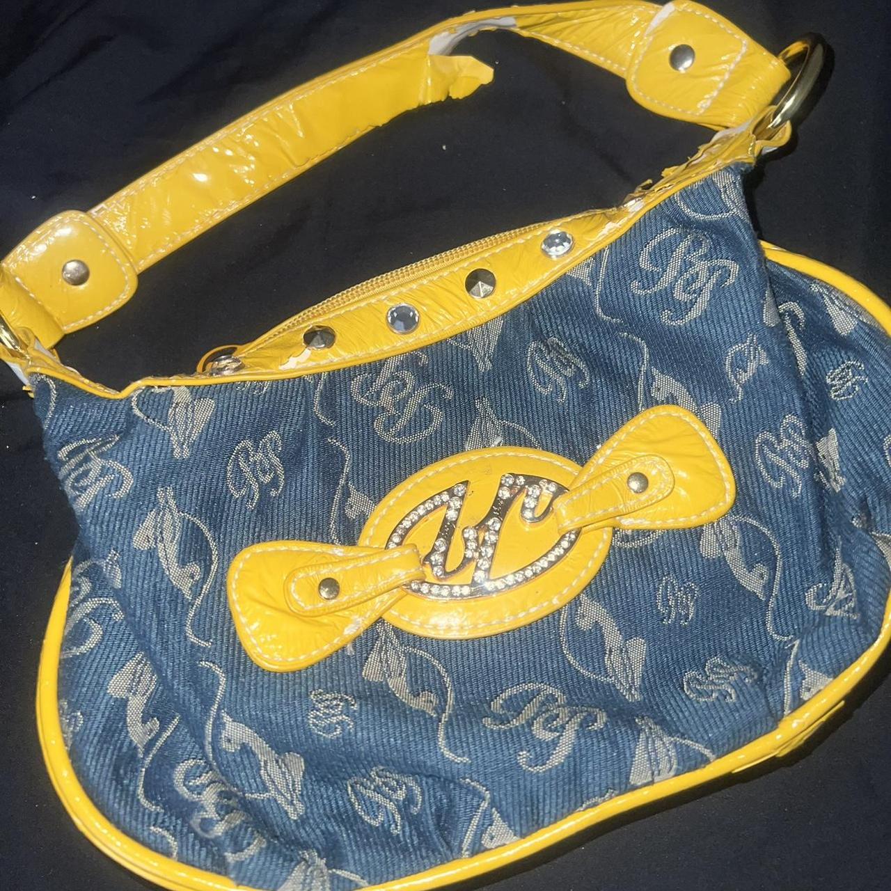 Baby Phat purse for sale. Worn condition as... Depop