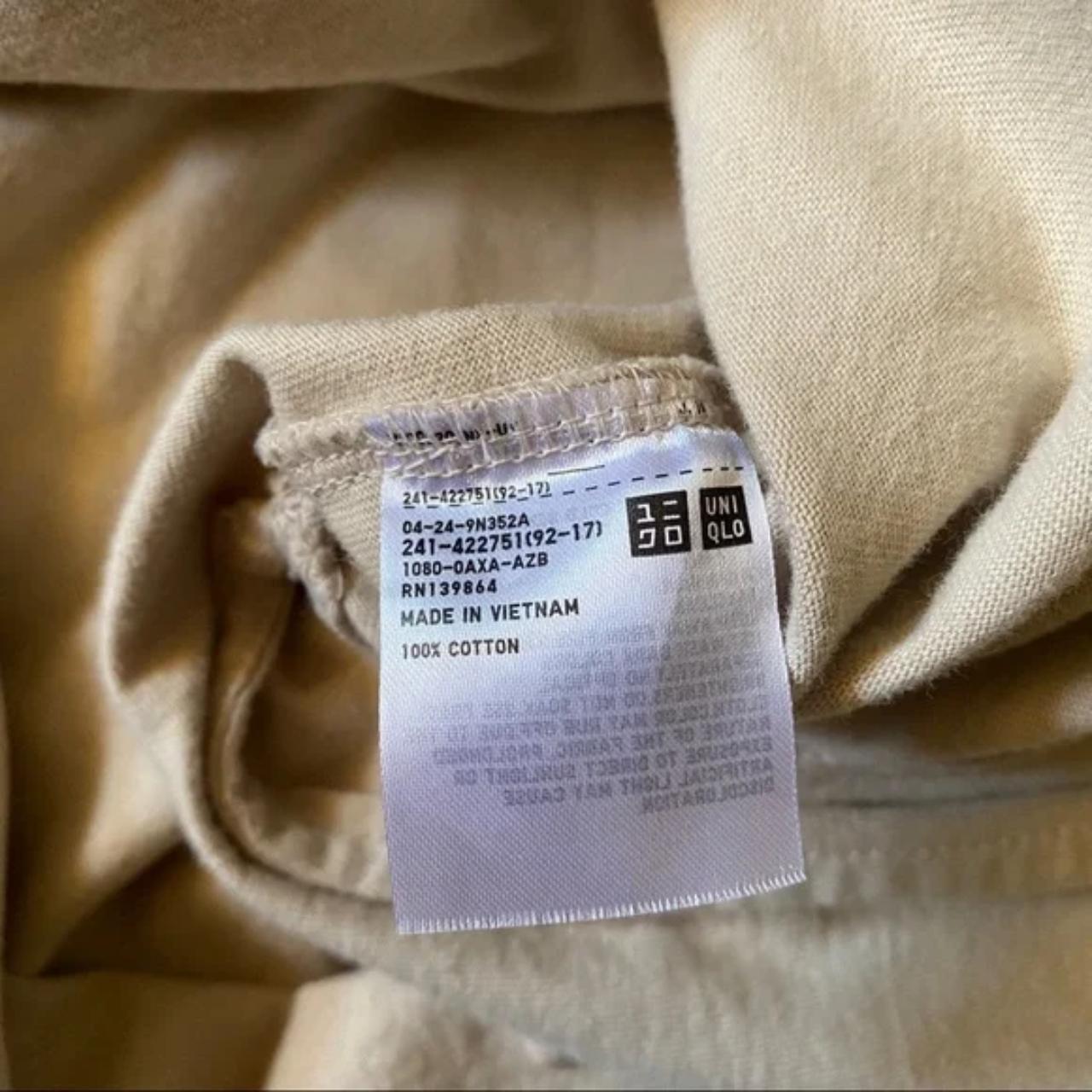 Uniqlo Solid Beige Tan Tee Shirt. It has slit hems... - Depop