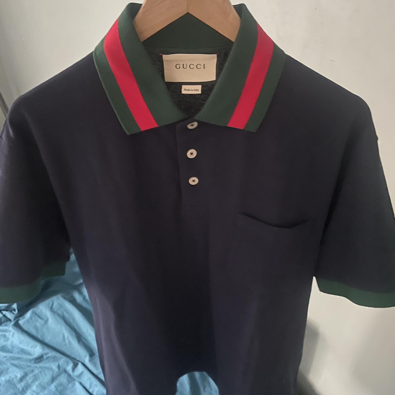 black gucci polo with red and green collar