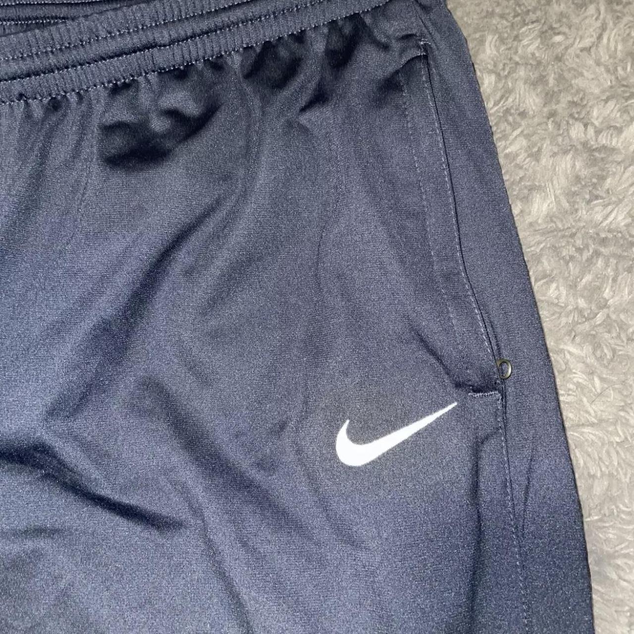 Women's Nike tracksuit bottoms / joggers Navy blue - Depop