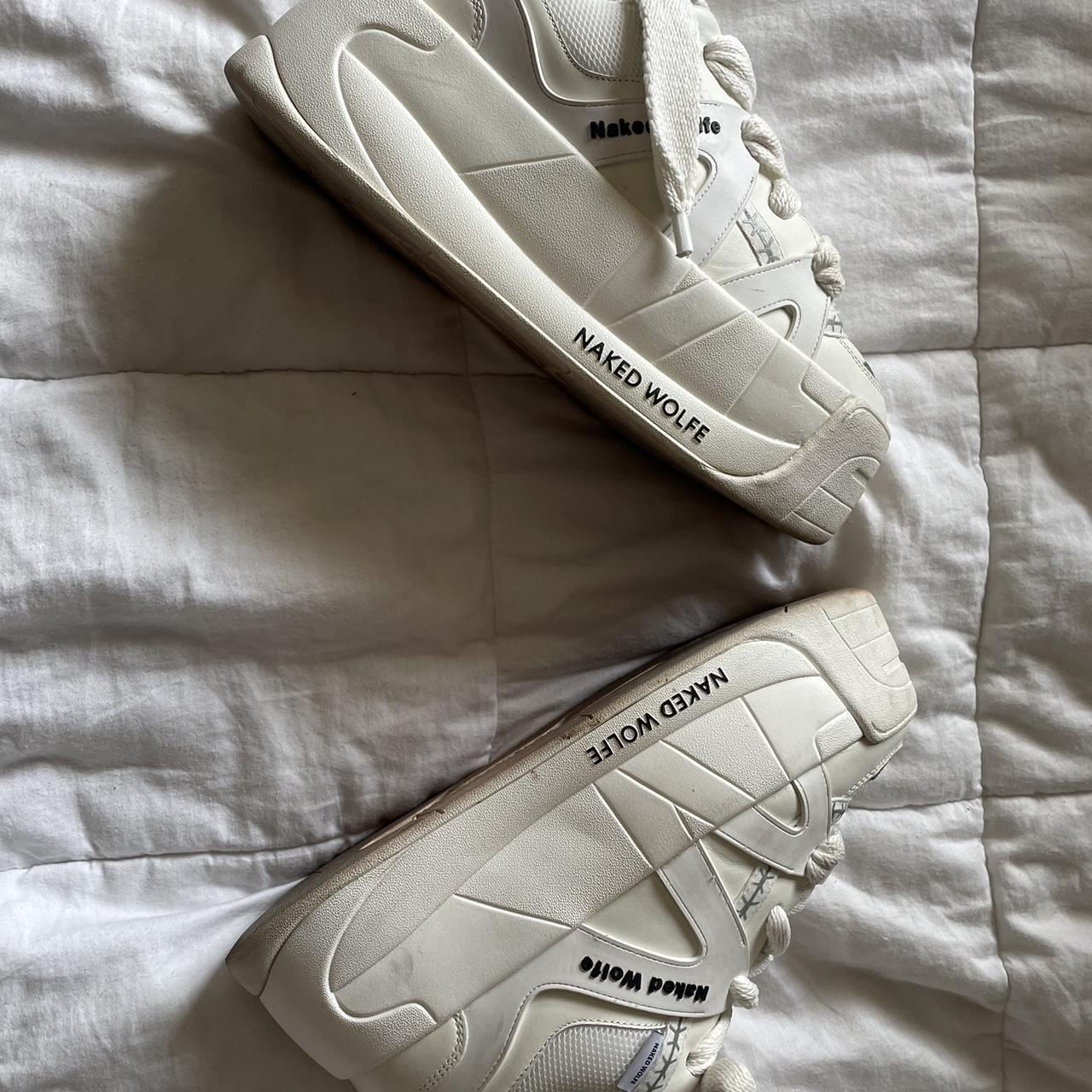 Naked Wolfe Women's White and Black Trainers | Depop
